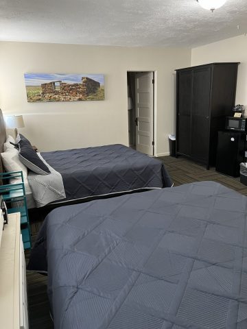 Comfortable double queen beds in a cozy Douglas hotel room.