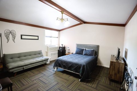 Comfortable double queen room with modern decor in Douglas, WY.