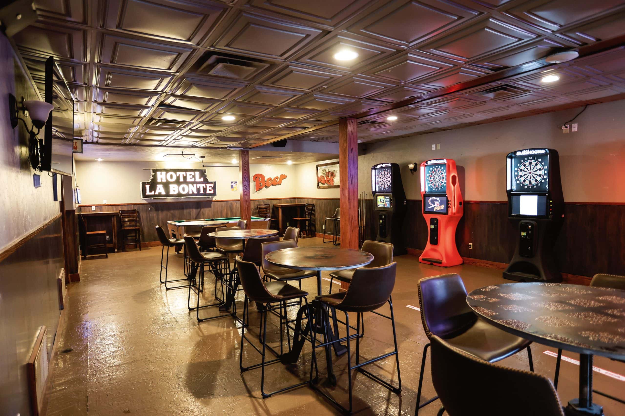 Indoor view of Hotel LaBonte's lounge with darts and gaming machines in Douglas WY.