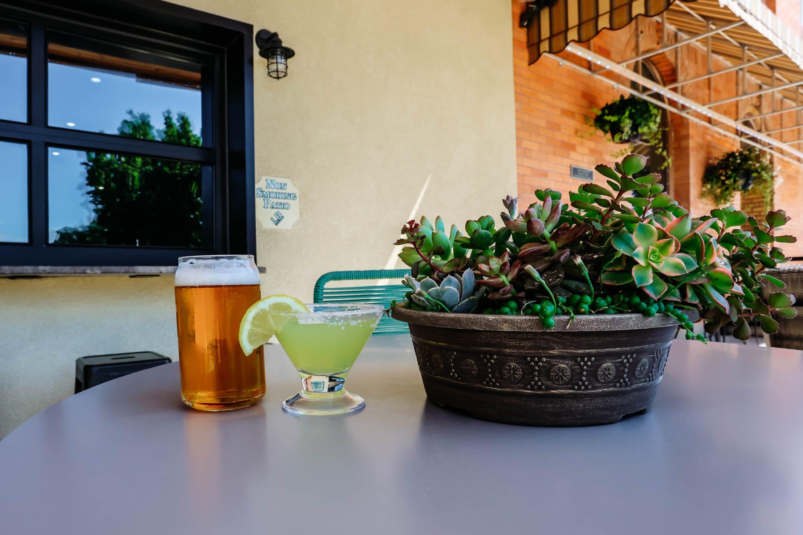 Outdoor patio at Hotel LaBonte in Douglas WY with drinks and plants.