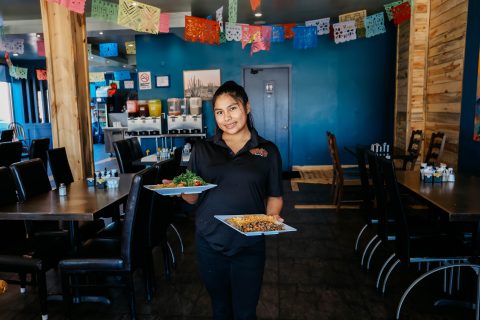 Waitress serving food at Hotel LaBonte in Douglas Wyoming.